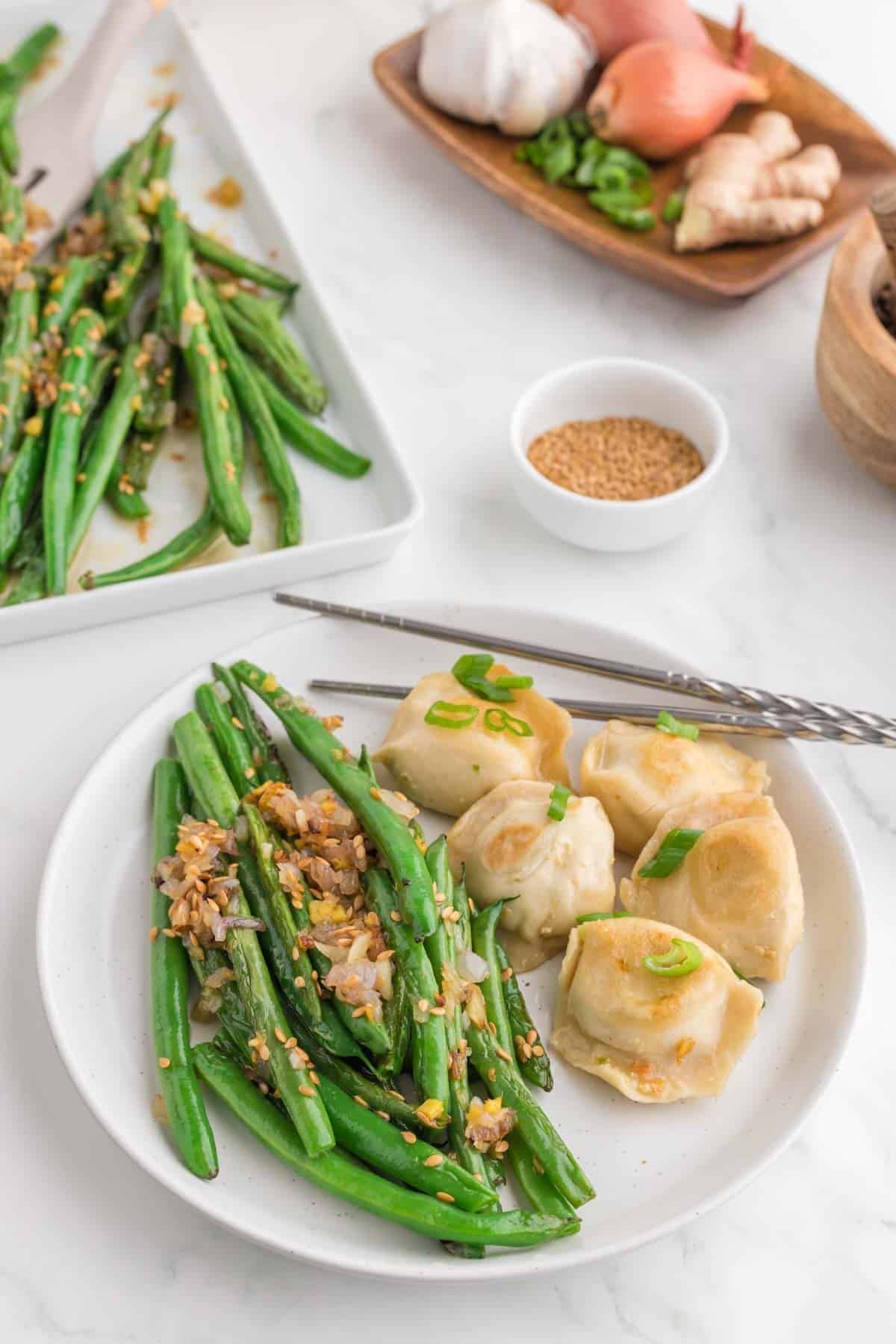 Looking for the best Chinese Green Beans recipe? These easy Asian Green Beans are crisp-tender, packed with garlic, ginger, shallots, and a savory touch of mirin for an irresistible restaurant-style side dish. If you've been searching for Chinese Green Bean Recipes, Garlic Green Beans, Stir Fry Green Beans, Green Bean Side Dish, Easy Vegetable Side Dishes, Healthy Green Bean Recipes, Asian Side Dishes, or How to Cook Fresh Green Beans, this simple recipe is a must-try. Perfect for busy weeknights, holiday dinners, or serving with your favorite chicken, beef, pork, or rice dishes, these flavorful sesame green beans come together in under 30 minutes and taste even better than takeout. Save this easy green bean recipe for your next family meal!