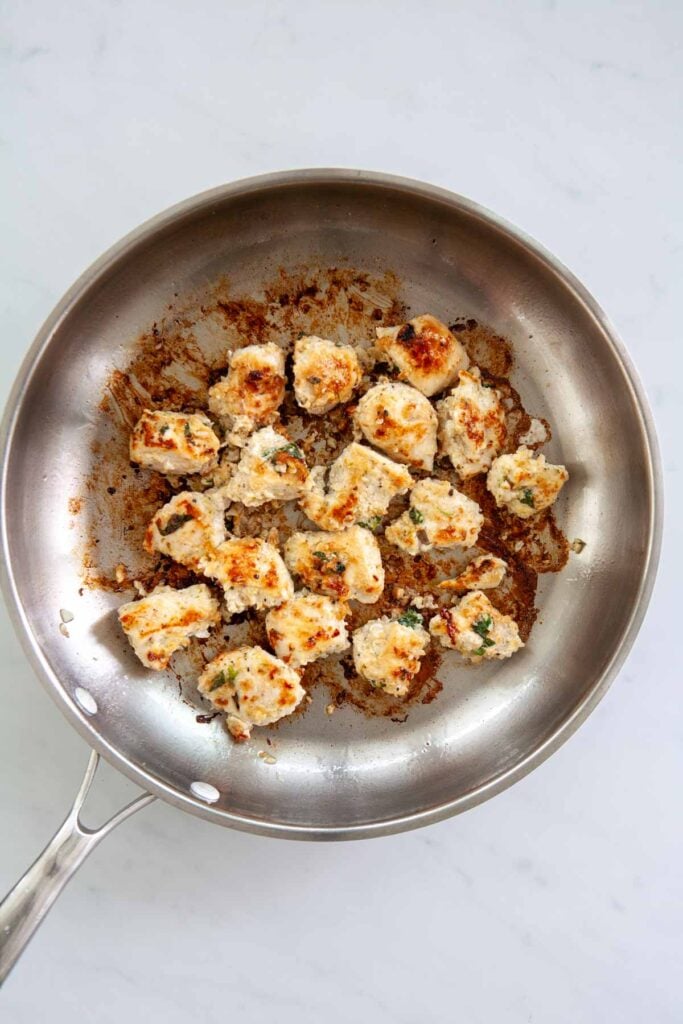 nicely browned chicken breast chunks in a skillet
