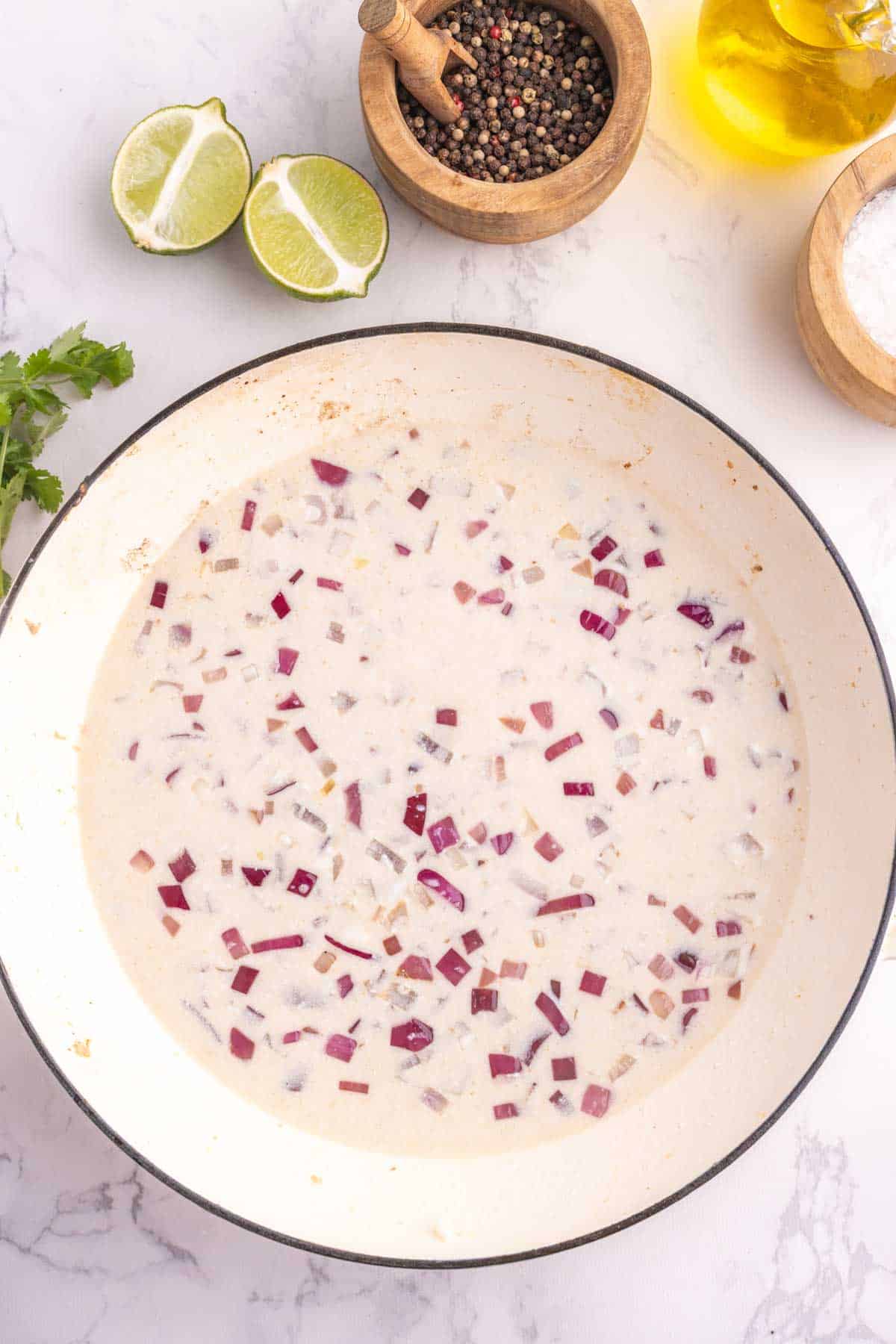 creamy sauce for coconut lime chicken in a skillet