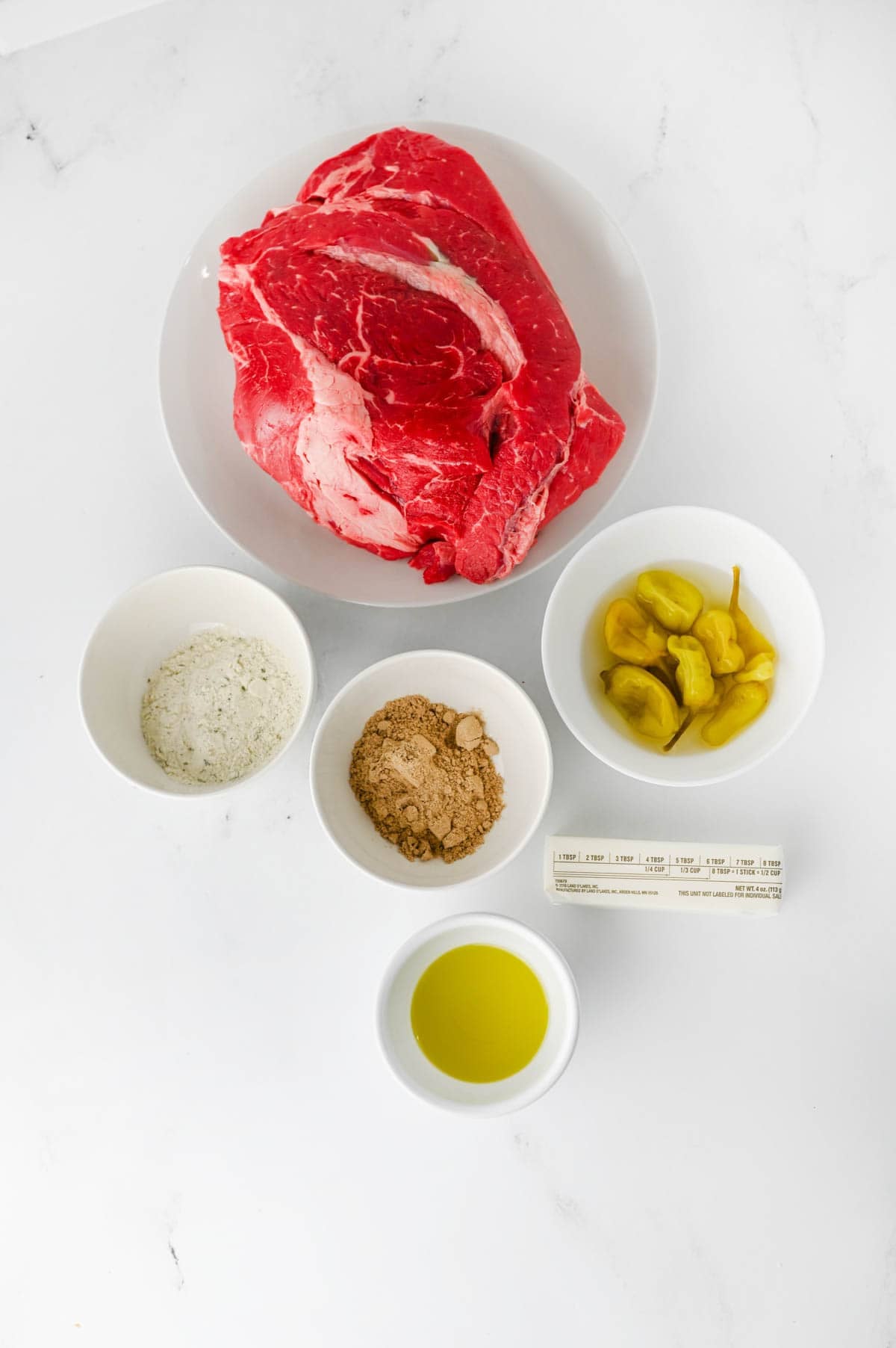crock pot mississippi pot roast ingredients on the kitchen counter