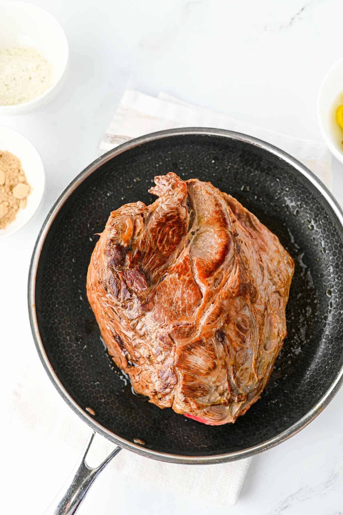 seared roast in a skillet