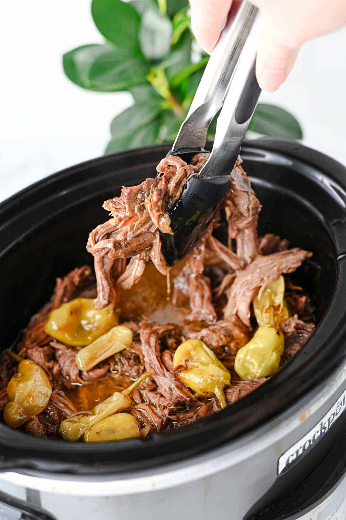 Looking for the best Crock Pot Mississippi Pot Roast recipe? This easy slow cooker Mississippi pot roast is made with chuck roast, ranch seasoning, au jus gravy mix, butter, and pepperoncini peppers for a rich, tender, melt-in-your-mouth dinner the whole family will love. Perfect for easy crock pot dinners, slow cooker beef recipes, comfort food recipes, Sunday dinner ideas, and busy weeknight meals, this recipe requires only 10 minutes of prep before the crock pot does all the work. Serve it over creamy mashed potatoes, rice, or egg noodles for a hearty meal that's packed with flavor. Save this simple Mississippi pot roast recipe for your next cozy family dinner or meal prep favorite!