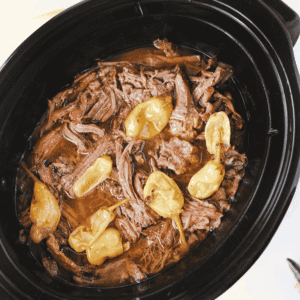 Looking for the best Crock Pot Mississippi Pot Roast recipe? This easy slow cooker Mississippi pot roast is made with chuck roast, ranch seasoning, au jus gravy mix, butter, and pepperoncini peppers for a rich, tender, melt-in-your-mouth dinner the whole family will love. Perfect for easy crock pot dinners, slow cooker beef recipes, comfort food recipes, Sunday dinner ideas, and busy weeknight meals, this recipe requires only 10 minutes of prep before the crock pot does all the work. Serve it over creamy mashed potatoes, rice, or egg noodles for a hearty meal that's packed with flavor. Save this simple Mississippi pot roast recipe for your next cozy family dinner or meal prep favorite!