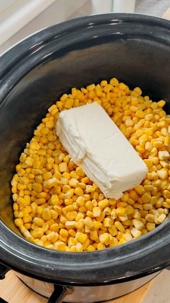 cream cheese and frozen corn in a crock pot