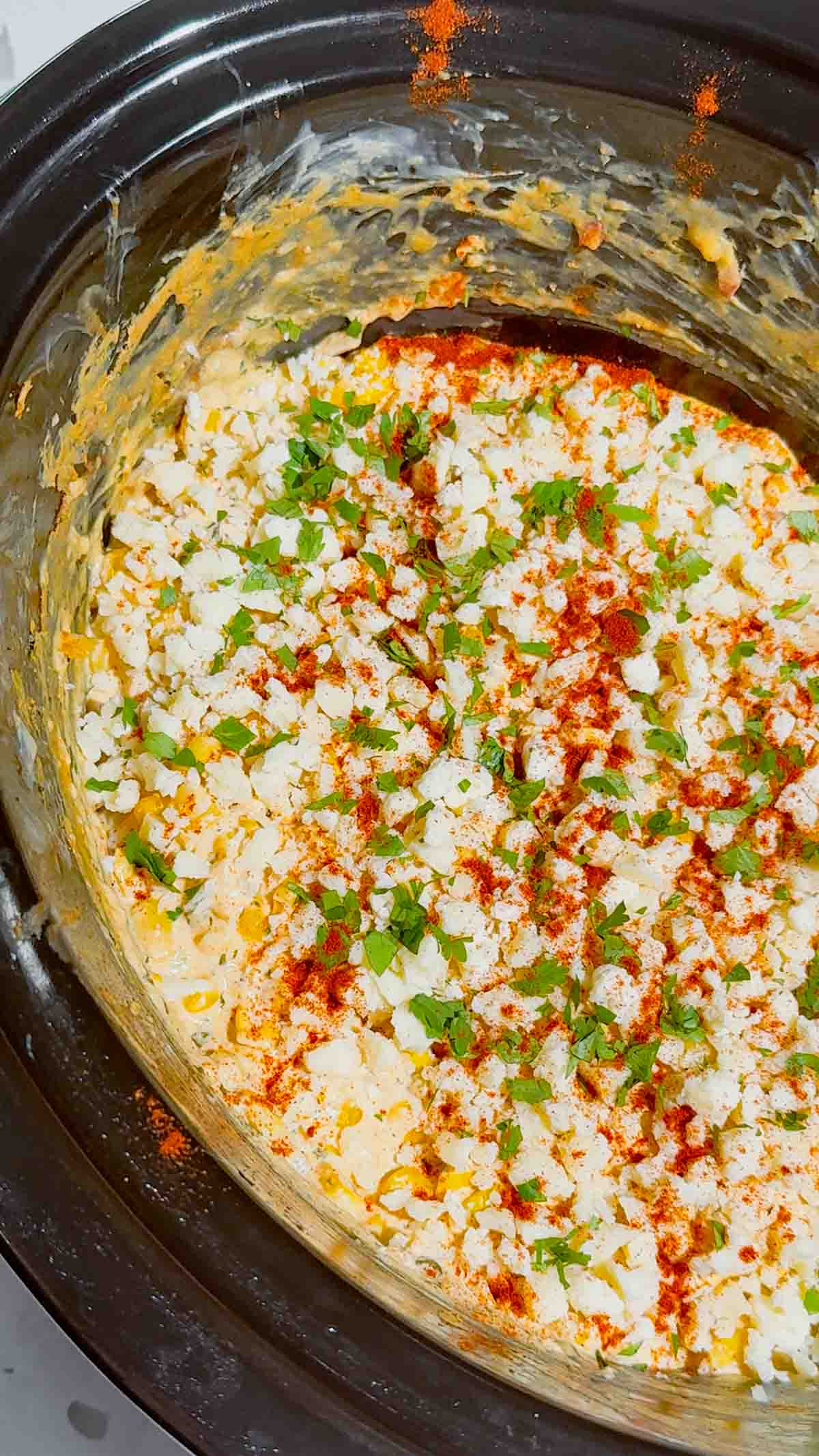 Looking for the ultimate Crock Pot Street Corn Dip recipe? This creamy Slow Cooker Mexican Street Corn Dip is loaded with frozen corn, cream cheese, pepper jack, sour cream, Cotija cheese, cilantro, lime, and smoky spices for an irresistible appetizer everyone will love. Perfect for Crockpot Dip Recipes, Game Day Food, Football Party Food, Cinco de Mayo Recipes, Easy Party Dips, Corn Dip Recipes, Slow Cooker Appetizers, Hot Cheese Dip, and Mexican Appetizers. Serve it with tortilla chips, crackers, or fresh veggies for an easy crowd-pleasing snack. Whether you're hosting a party, potluck, BBQ, or holiday gathering, this cheesy street corn dip is a simple make-ahead recipe that's guaranteed to disappear fast.