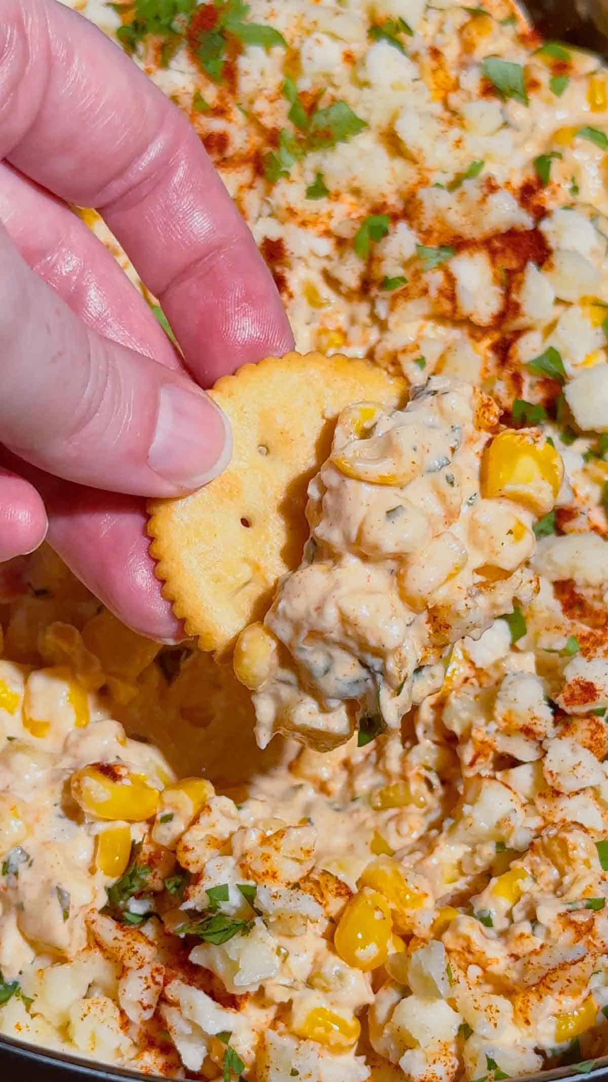 Looking for the ultimate Crock Pot Street Corn Dip recipe? This creamy Slow Cooker Mexican Street Corn Dip is loaded with frozen corn, cream cheese, pepper jack, sour cream, Cotija cheese, cilantro, lime, and smoky spices for an irresistible appetizer everyone will love. Perfect for Crockpot Dip Recipes, Game Day Food, Football Party Food, Cinco de Mayo Recipes, Easy Party Dips, Corn Dip Recipes, Slow Cooker Appetizers, Hot Cheese Dip, and Mexican Appetizers. Serve it with tortilla chips, crackers, or fresh veggies for an easy crowd-pleasing snack. Whether you're hosting a party, potluck, BBQ, or holiday gathering, this cheesy street corn dip is a simple make-ahead recipe that's guaranteed to disappear fast.