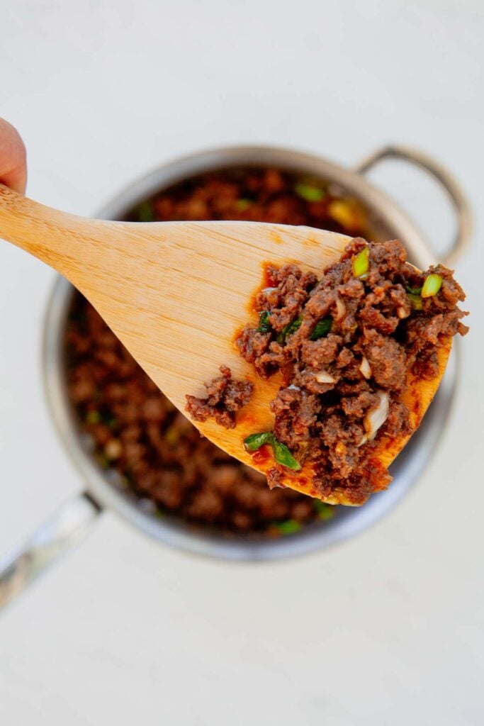 Craving a fast dinner that's packed with flavor? These Korean Ground Beef Bowls are the ultimate weeknight meal, made with tender ground beef coated in a sweet, savory, and slightly spicy Korean-inspired sauce with soy sauce, brown sugar, garlic, ginger, sesame oil, and gochujang. Served over fluffy rice and topped with green onions and sesame seeds, this easy Ground Beef Bowl is ready in just 15 minutes. Perfect for Easy Ground Beef Recipes, Korean Beef Rice Bowls, Ground Beef Dinner Ideas, Quick Family Meals, Asian Inspired Recipes, Weeknight Dinner Recipes, Meal Prep Bowls, Rice Bowl Recipes, Ground Beef and Rice, and Budget Friendly Dinners, this simple recipe is one you'll make again and again.