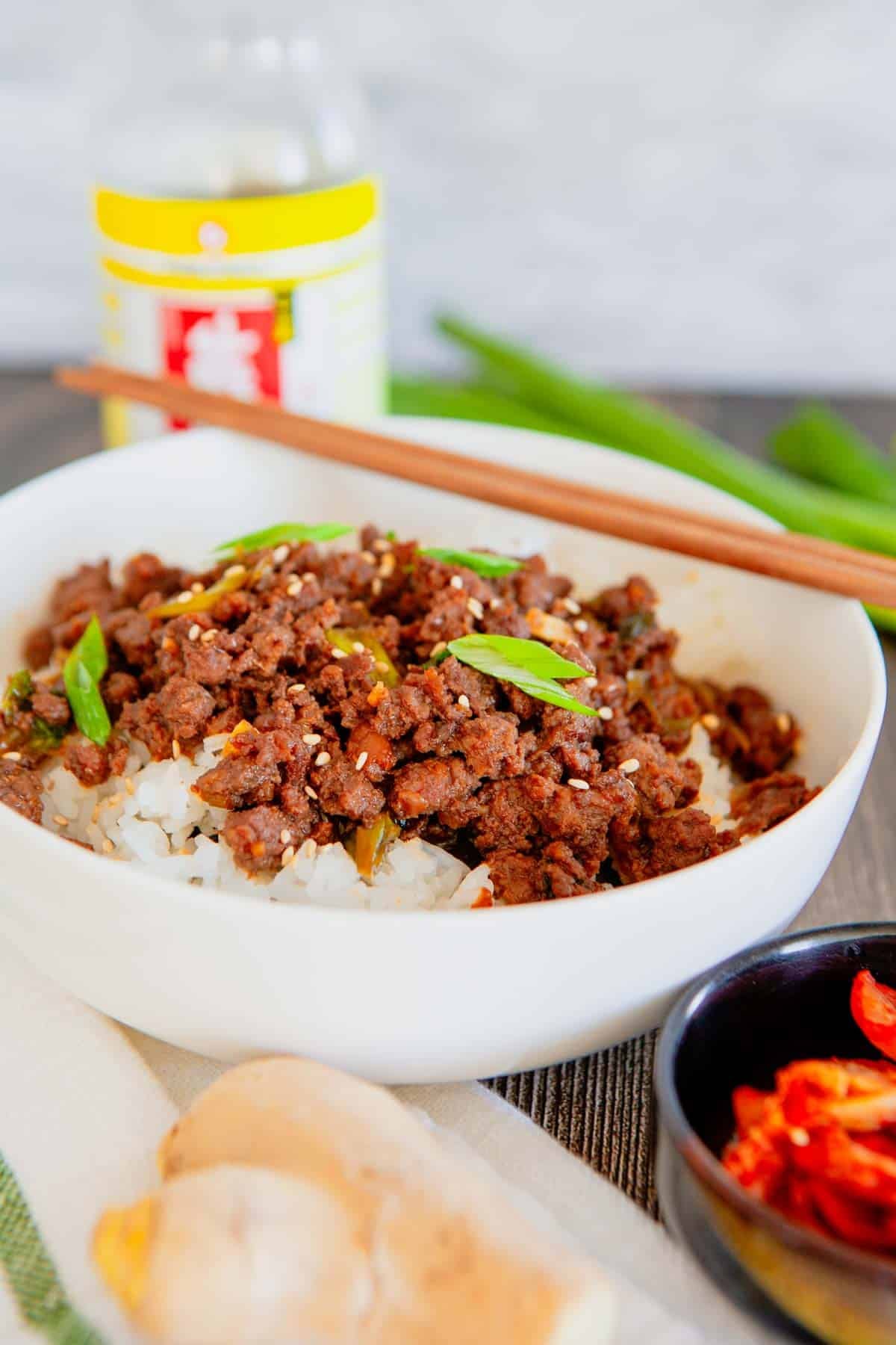 Craving a fast dinner that's packed with flavor? These Korean Ground Beef Bowls are the ultimate weeknight meal, made with tender ground beef coated in a sweet, savory, and slightly spicy Korean-inspired sauce with soy sauce, brown sugar, garlic, ginger, sesame oil, and gochujang. Served over fluffy rice and topped with green onions and sesame seeds, this easy Ground Beef Bowl is ready in just 15 minutes. Perfect for Easy Ground Beef Recipes, Korean Beef Rice Bowls, Ground Beef Dinner Ideas, Quick Family Meals, Asian Inspired Recipes, Weeknight Dinner Recipes, Meal Prep Bowls, Rice Bowl Recipes, Ground Beef and Rice, and Budget Friendly Dinners, this simple recipe is one you'll make again and again.