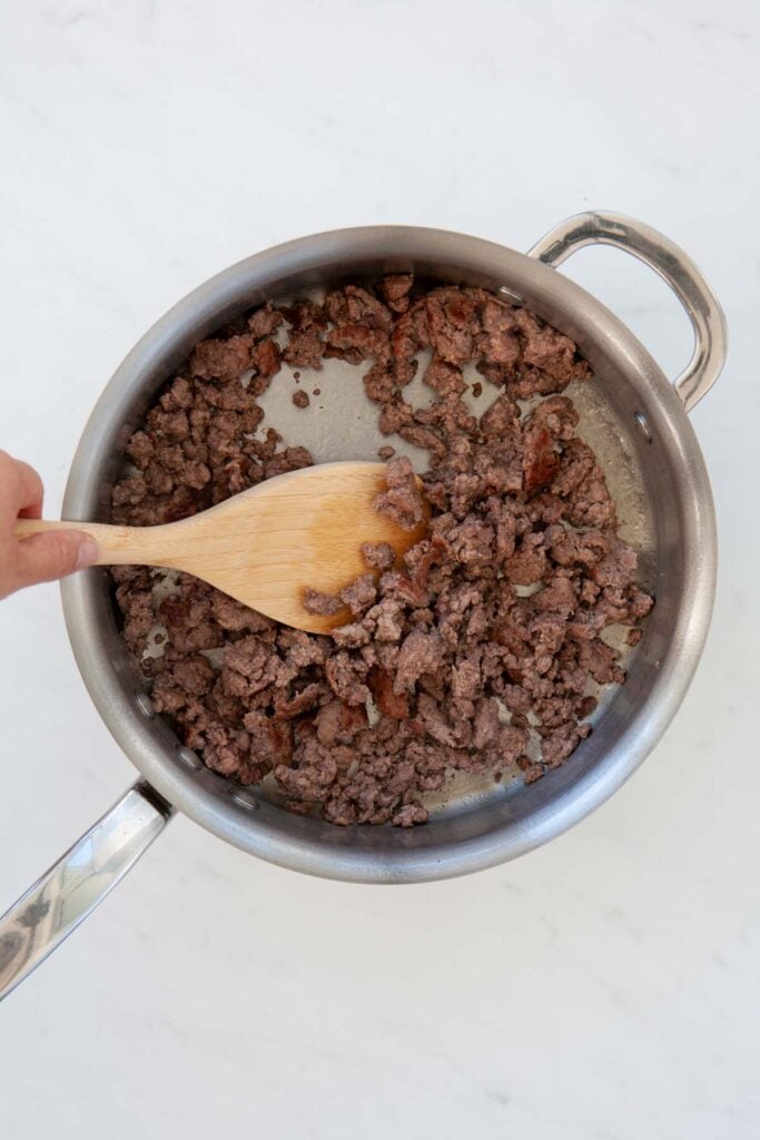 ground beef cooking in a skillet