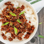 Craving a fast dinner that's packed with flavor? These Korean Ground Beef Bowls are the ultimate weeknight meal, made with tender ground beef coated in a sweet, savory, and slightly spicy Korean-inspired sauce with soy sauce, brown sugar, garlic, ginger, sesame oil, and gochujang. Served over fluffy rice and topped with green onions and sesame seeds, this easy Ground Beef Bowl is ready in just 15 minutes. Perfect for Easy Ground Beef Recipes, Korean Beef Rice Bowls, Ground Beef Dinner Ideas, Quick Family Meals, Asian Inspired Recipes, Weeknight Dinner Recipes, Meal Prep Bowls, Rice Bowl Recipes, Ground Beef and Rice, and Budget Friendly Dinners, this simple recipe is one you'll make again and again.