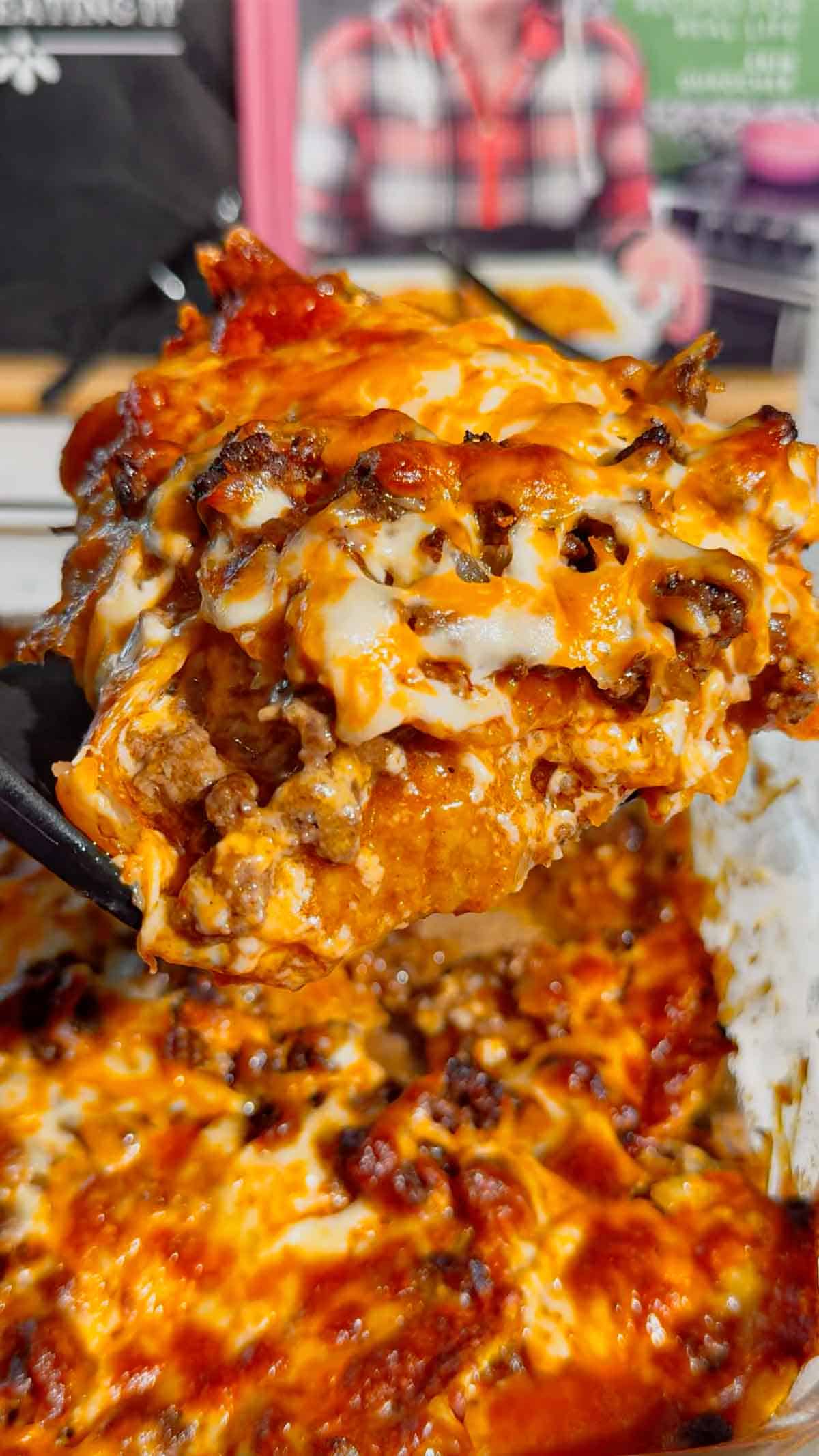 Looking for an easy enchilada casserole the whole family will love? These Lazy Enchiladas are packed with seasoned ground beef, crunchy tortilla chips, rich red enchilada sauce, and loads of melted cheddar cheese for the ultimate comfort food dinner. This simple Mexican-inspired casserole skips the rolling but keeps all the bold flavor, making it perfect for busy weeknights, family dinners, potlucks, and meal prep. If you love easy ground beef recipes, cheesy casserole recipes, Tex-Mex dinners, quick family meals, tortilla chip casseroles, budget-friendly dinners, and simple comfort food recipes, this Lazy Enchiladas recipe is guaranteed to become a regular on your dinner menu. Save this easy enchilada casserole recipe for your next stress-free dinner!