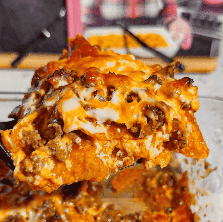 Looking for an easy enchilada casserole the whole family will love? These Lazy Enchiladas are packed with seasoned ground beef, crunchy tortilla chips, rich red enchilada sauce, and loads of melted cheddar cheese for the ultimate comfort food dinner. This simple Mexican-inspired casserole skips the rolling but keeps all the bold flavor, making it perfect for busy weeknights, family dinners, potlucks, and meal prep. If you love easy ground beef recipes, cheesy casserole recipes, Tex-Mex dinners, quick family meals, tortilla chip casseroles, budget-friendly dinners, and simple comfort food recipes, this Lazy Enchiladas recipe is guaranteed to become a regular on your dinner menu. Save this easy enchilada casserole recipe for your next stress-free dinner!