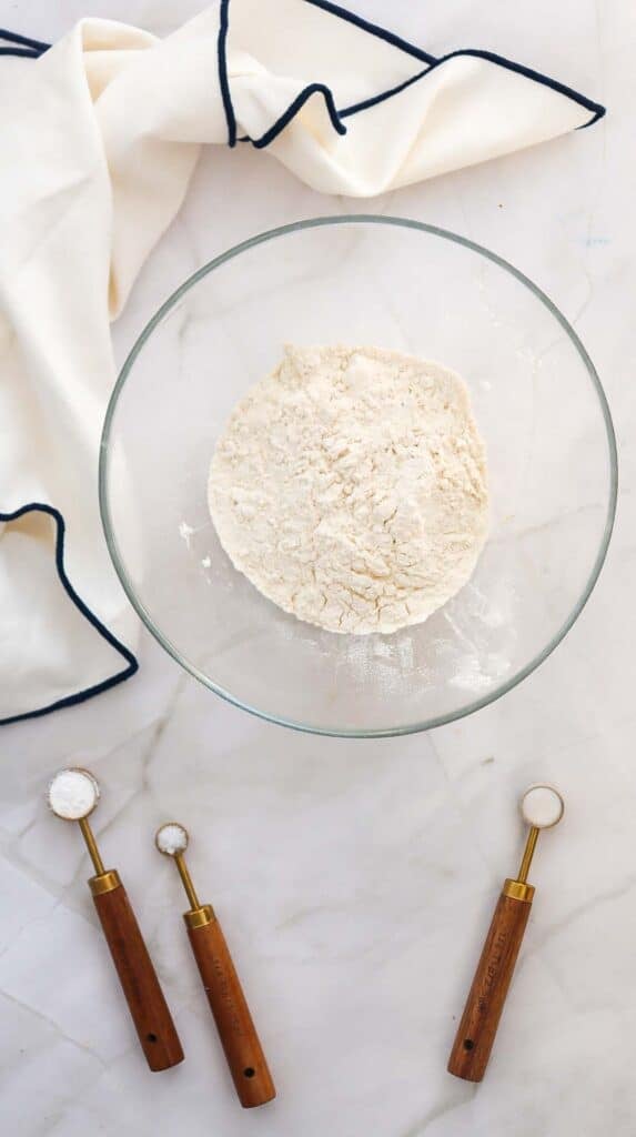 flour, baking powder, baking soda and salt in a glass mixing bowl