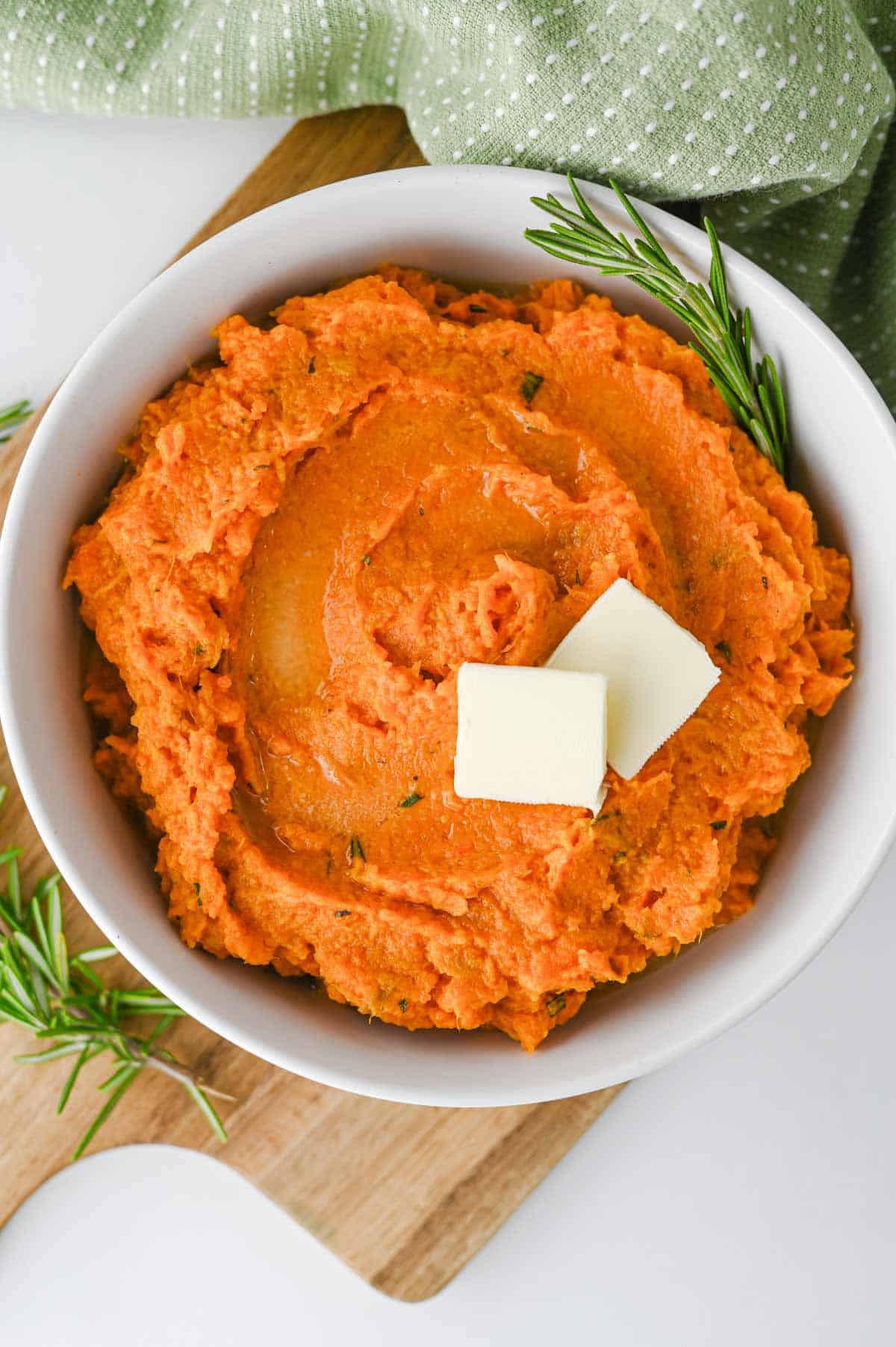 These Mashed Sweet Potatoes are the ultimate creamy, buttery side dish for holidays and family dinners. If you're looking for the best mashed sweet potatoes recipe, this easy homemade version is packed with fresh sage, rosemary, maple syrup, cinnamon, and nutmeg for incredible flavor in every bite. These creamy sweet potatoes are smooth, rich, and perfect for Thanksgiving, Christmas, Easter, or Sunday dinner. Whether you need an easy holiday side dish, sweet potato recipes, Thanksgiving side dishes, mashed potatoes alternative, or comforting fall recipes, this simple recipe is always a crowd-pleaser. Save this delicious homemade mashed sweet potatoes recipe for your next festive meal or cozy family dinner!