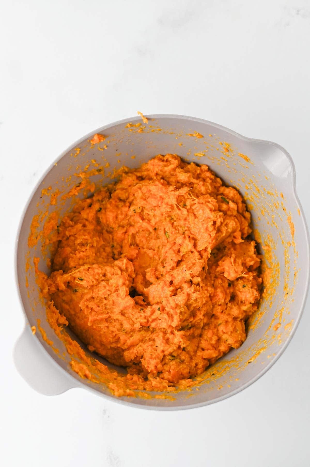 These Mashed Sweet Potatoes are the ultimate creamy, buttery side dish for holidays and family dinners. If you're looking for the best mashed sweet potatoes recipe, this easy homemade version is packed with fresh sage, rosemary, maple syrup, cinnamon, and nutmeg for incredible flavor in every bite. These creamy sweet potatoes are smooth, rich, and perfect for Thanksgiving, Christmas, Easter, or Sunday dinner. Whether you need an easy holiday side dish, sweet potato recipes, Thanksgiving side dishes, mashed potatoes alternative, or comforting fall recipes, this simple recipe is always a crowd-pleaser. Save this delicious homemade mashed sweet potatoes recipe for your next festive meal or cozy family dinner!