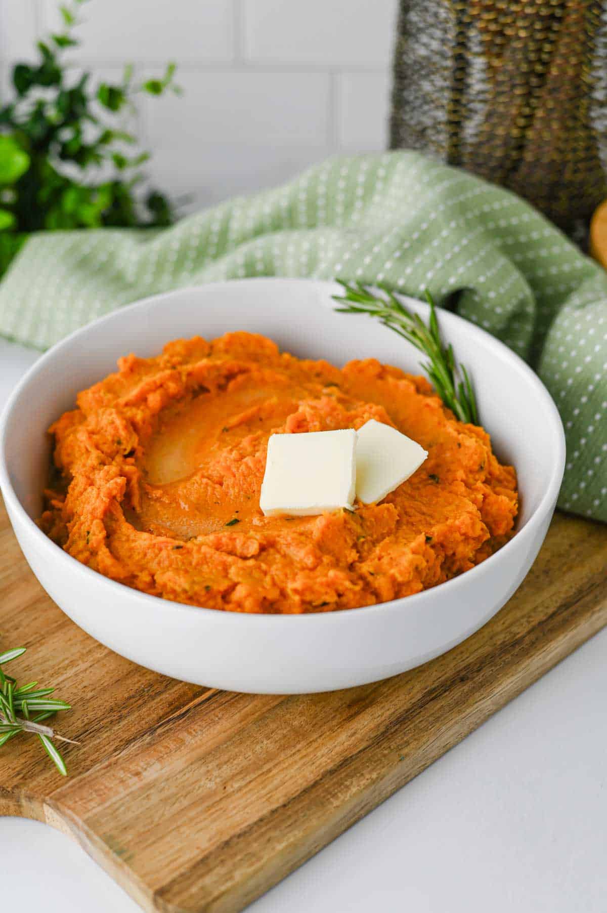 These Mashed Sweet Potatoes are the ultimate creamy, buttery side dish for holidays and family dinners. If you're looking for the best mashed sweet potatoes recipe, this easy homemade version is packed with fresh sage, rosemary, maple syrup, cinnamon, and nutmeg for incredible flavor in every bite. These creamy sweet potatoes are smooth, rich, and perfect for Thanksgiving, Christmas, Easter, or Sunday dinner. Whether you need an easy holiday side dish, sweet potato recipes, Thanksgiving side dishes, mashed potatoes alternative, or comforting fall recipes, this simple recipe is always a crowd-pleaser. Save this delicious homemade mashed sweet potatoes recipe for your next festive meal or cozy family dinner!