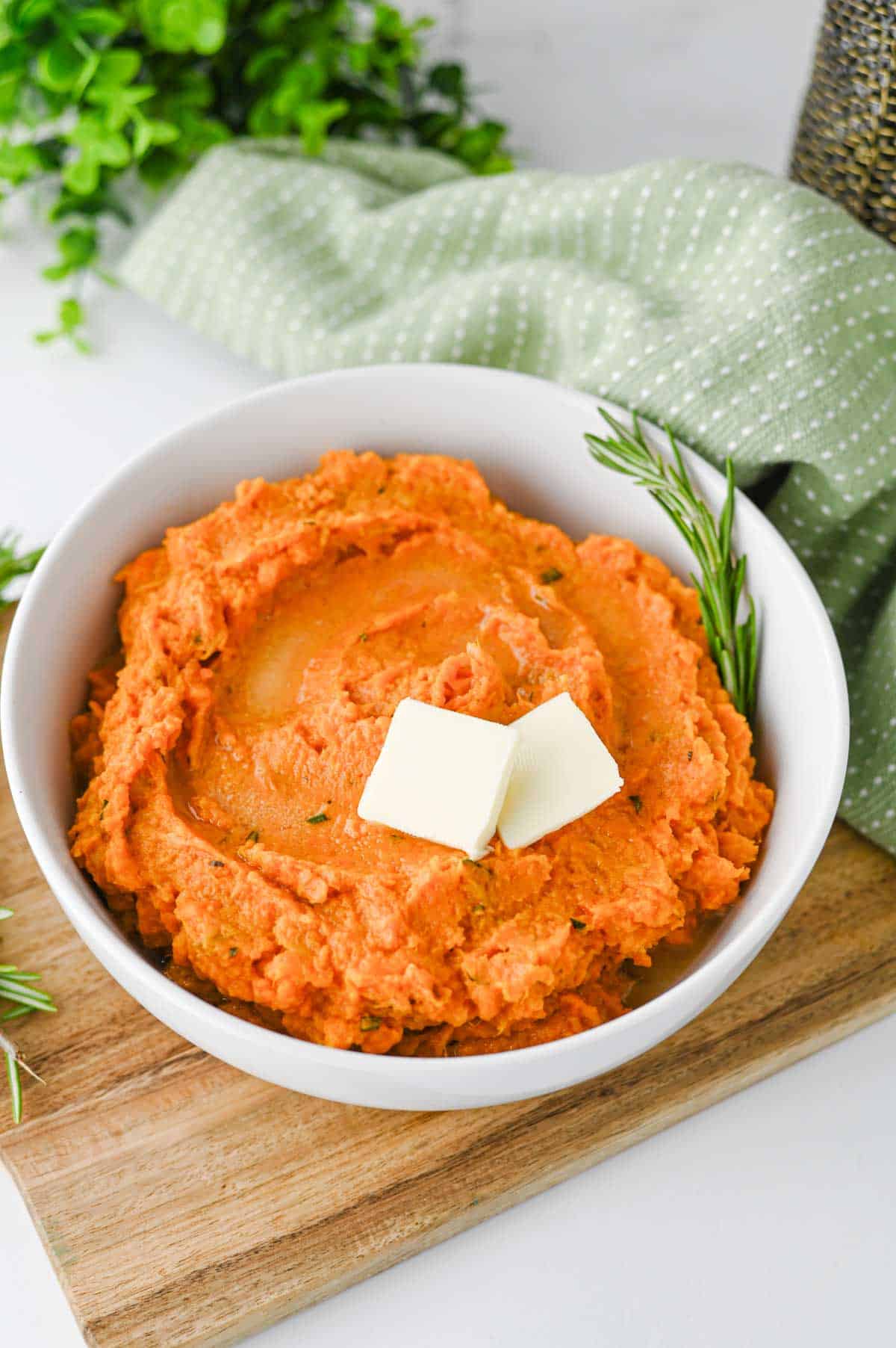 These Mashed Sweet Potatoes are the ultimate creamy, buttery side dish for holidays and family dinners. If you're looking for the best mashed sweet potatoes recipe, this easy homemade version is packed with fresh sage, rosemary, maple syrup, cinnamon, and nutmeg for incredible flavor in every bite. These creamy sweet potatoes are smooth, rich, and perfect for Thanksgiving, Christmas, Easter, or Sunday dinner. Whether you need an easy holiday side dish, sweet potato recipes, Thanksgiving side dishes, mashed potatoes alternative, or comforting fall recipes, this simple recipe is always a crowd-pleaser. Save this delicious homemade mashed sweet potatoes recipe for your next festive meal or cozy family dinner!