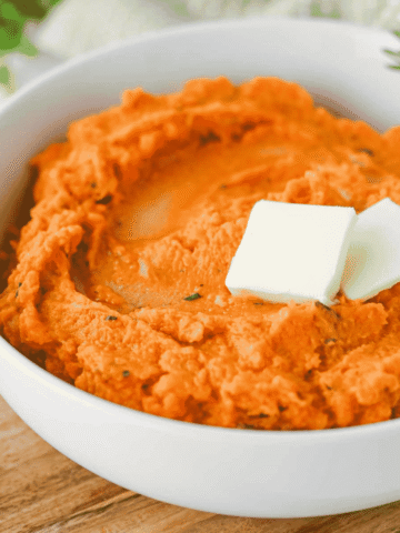 These Mashed Sweet Potatoes are the ultimate creamy, buttery side dish for holidays and family dinners. If you're looking for the best mashed sweet potatoes recipe, this easy homemade version is packed with fresh sage, rosemary, maple syrup, cinnamon, and nutmeg for incredible flavor in every bite. These creamy sweet potatoes are smooth, rich, and perfect for Thanksgiving, Christmas, Easter, or Sunday dinner. Whether you need an easy holiday side dish, sweet potato recipes, Thanksgiving side dishes, mashed potatoes alternative, or comforting fall recipes, this simple recipe is always a crowd-pleaser. Save this delicious homemade mashed sweet potatoes recipe for your next festive meal or cozy family dinner!