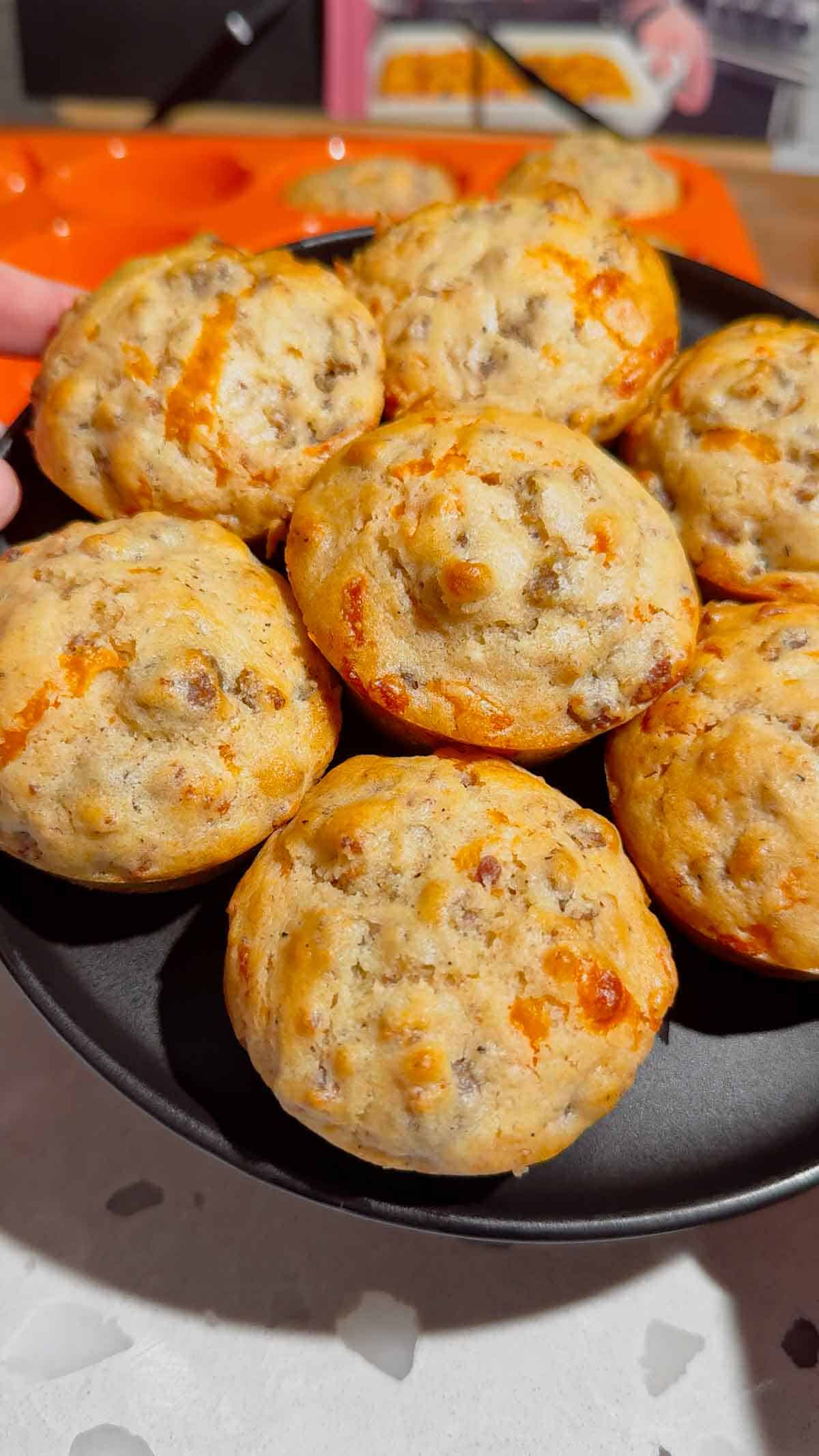 Looking for the ultimate make ahead breakfast? These McGriddle Muffins combine fluffy pancake batter, maple sausage, crispy bacon, melted cheddar cheese, and sweet maple syrup into the perfect grab-and-go breakfast recipe. They're freezer friendly, meal prep approved, kid friendly, and ready in just 30 minutes, making them ideal for busy weekday mornings, weekend brunch, school breakfasts, and holiday mornings. If you love easy breakfast recipes, breakfast muffins, pancake muffins, savory breakfast ideas, maple sausage recipes, brunch recipes, breakfast meal prep, freezer breakfast recipes, and family breakfast ideas, these homemade McGriddle Muffins are a delicious shortcut everyone will request again and again.