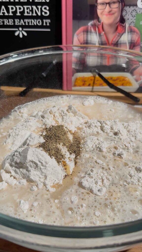 salt, pepper, water and pancake mix in a glass bowl