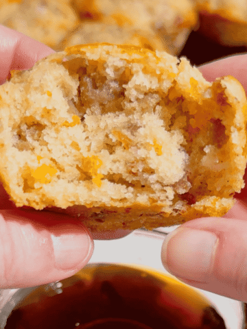 Looking for the ultimate make ahead breakfast? These McGriddle Muffins combine fluffy pancake batter, maple sausage, crispy bacon, melted cheddar cheese, and sweet maple syrup into the perfect grab-and-go breakfast recipe. They're freezer friendly, meal prep approved, kid friendly, and ready in just 30 minutes, making them ideal for busy weekday mornings, weekend brunch, school breakfasts, and holiday mornings. If you love easy breakfast recipes, breakfast muffins, pancake muffins, savory breakfast ideas, maple sausage recipes, brunch recipes, breakfast meal prep, freezer breakfast recipes, and family breakfast ideas, these homemade McGriddle Muffins are a delicious shortcut everyone will request again and again.