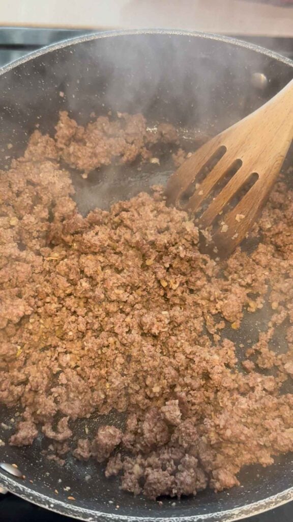 cooked ground beef in a skillet