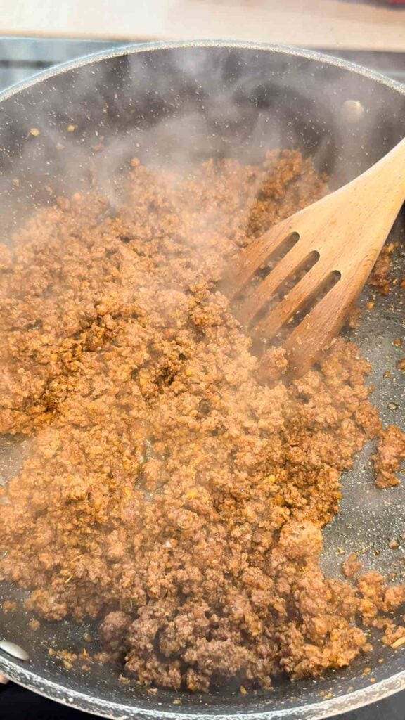 seasoned taco ground beef in a skillet