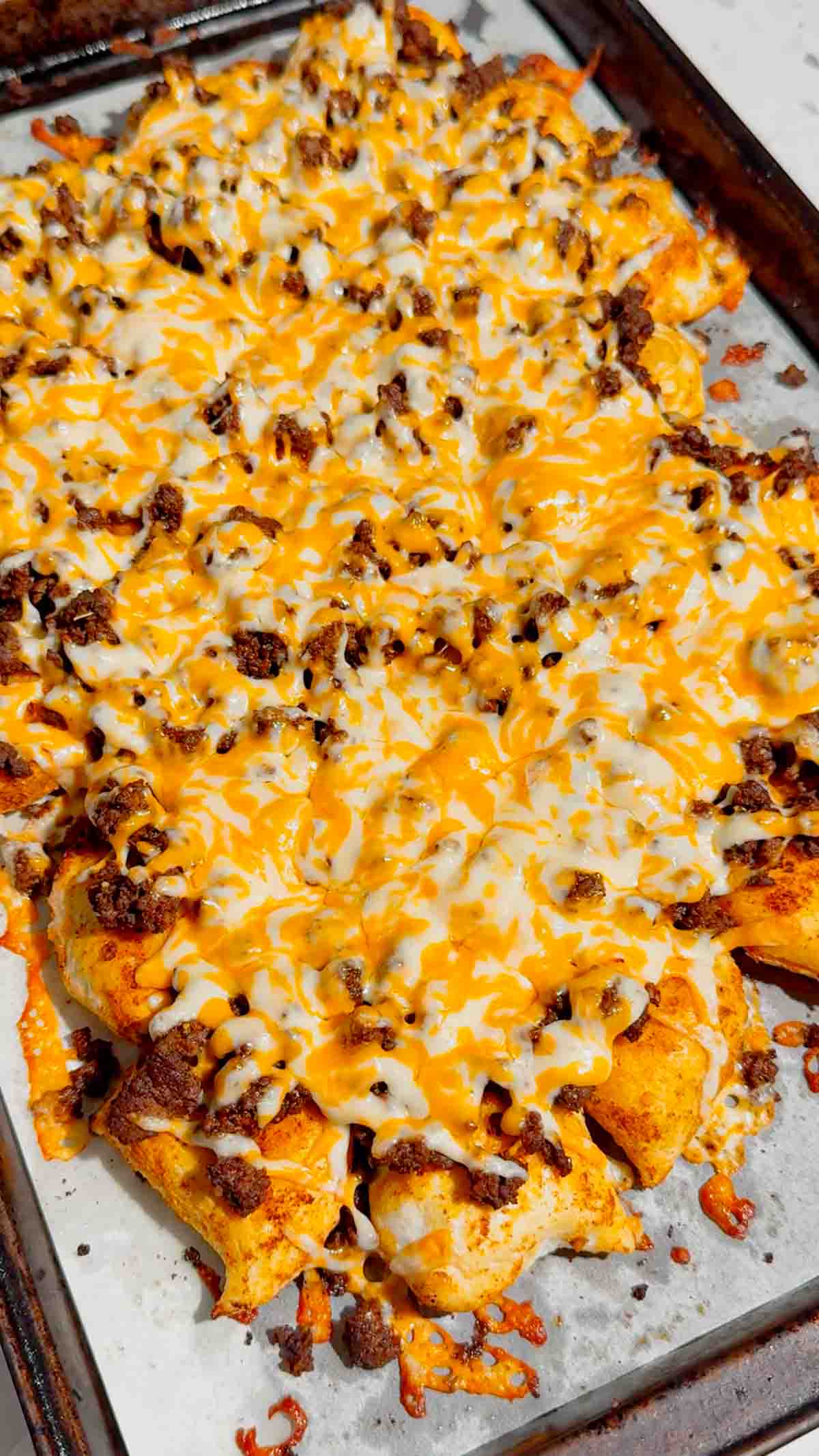 Looking for a fun twist on taco night? These Pierogi Nachos combine crispy baked cheddar pierogies, seasoned ground beef, gooey melted cheddar cheese, and your favorite nacho toppings for the ultimate comfort food dinner. This easy pierogi recipe is perfect for weeknight dinner ideas, ground beef recipes, easy family meals, sheet pan dinners, party food, game day snacks, and quick dinner recipes everyone will devour. If you love loaded nachos, cheesy casseroles, and creative comfort food, this recipe is a must-try. Save this delicious Pierogi Nachos recipe for busy nights, potlucks, casual gatherings, or whenever you're craving a cheesy, crispy, flavor-packed dinner that's simple to make and guaranteed to impress family and friends.