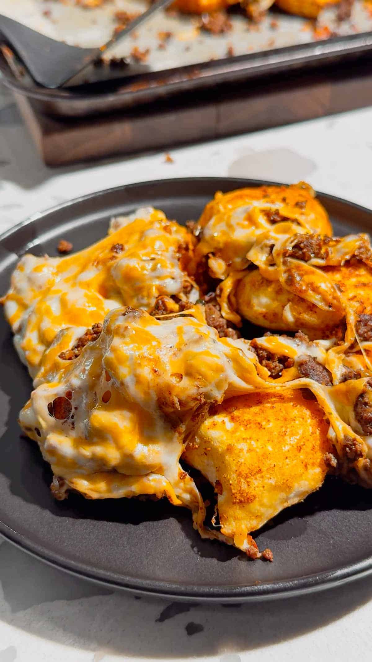 Looking for a fun twist on taco night? These Pierogi Nachos combine crispy baked cheddar pierogies, seasoned ground beef, gooey melted cheddar cheese, and your favorite nacho toppings for the ultimate comfort food dinner. This easy pierogi recipe is perfect for weeknight dinner ideas, ground beef recipes, easy family meals, sheet pan dinners, party food, game day snacks, and quick dinner recipes everyone will devour. If you love loaded nachos, cheesy casseroles, and creative comfort food, this recipe is a must-try. Save this delicious Pierogi Nachos recipe for busy nights, potlucks, casual gatherings, or whenever you're craving a cheesy, crispy, flavor-packed dinner that's simple to make and guaranteed to impress family and friends.