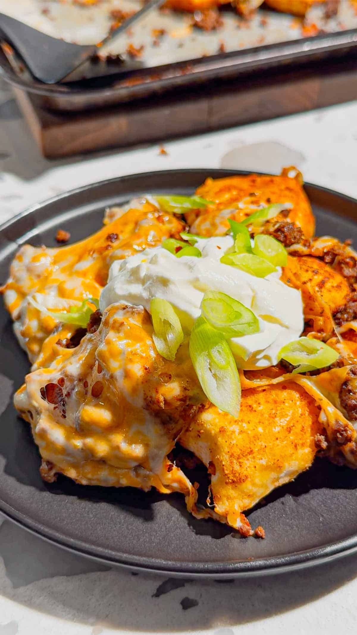 Looking for a fun twist on taco night? These Pierogi Nachos combine crispy baked cheddar pierogies, seasoned ground beef, gooey melted cheddar cheese, and your favorite nacho toppings for the ultimate comfort food dinner. This easy pierogi recipe is perfect for weeknight dinner ideas, ground beef recipes, easy family meals, sheet pan dinners, party food, game day snacks, and quick dinner recipes everyone will devour. If you love loaded nachos, cheesy casseroles, and creative comfort food, this recipe is a must-try. Save this delicious Pierogi Nachos recipe for busy nights, potlucks, casual gatherings, or whenever you're craving a cheesy, crispy, flavor-packed dinner that's simple to make and guaranteed to impress family and friends.