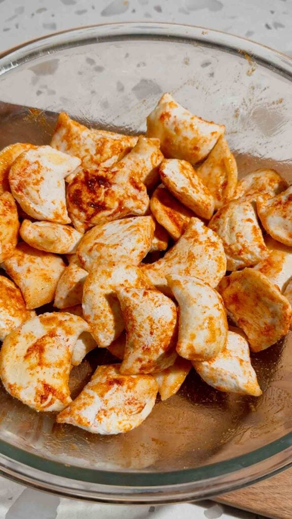 seasoned pierogies in a mixing bowl