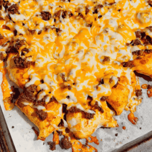 Looking for a fun twist on taco night? These Pierogi Nachos combine crispy baked cheddar pierogies, seasoned ground beef, gooey melted cheddar cheese, and your favorite nacho toppings for the ultimate comfort food dinner. This easy pierogi recipe is perfect for weeknight dinner ideas, ground beef recipes, easy family meals, sheet pan dinners, party food, game day snacks, and quick dinner recipes everyone will devour. If you love loaded nachos, cheesy casseroles, and creative comfort food, this recipe is a must-try. Save this delicious Pierogi Nachos recipe for busy nights, potlucks, casual gatherings, or whenever you're craving a cheesy, crispy, flavor-packed dinner that's simple to make and guaranteed to impress family and friends.