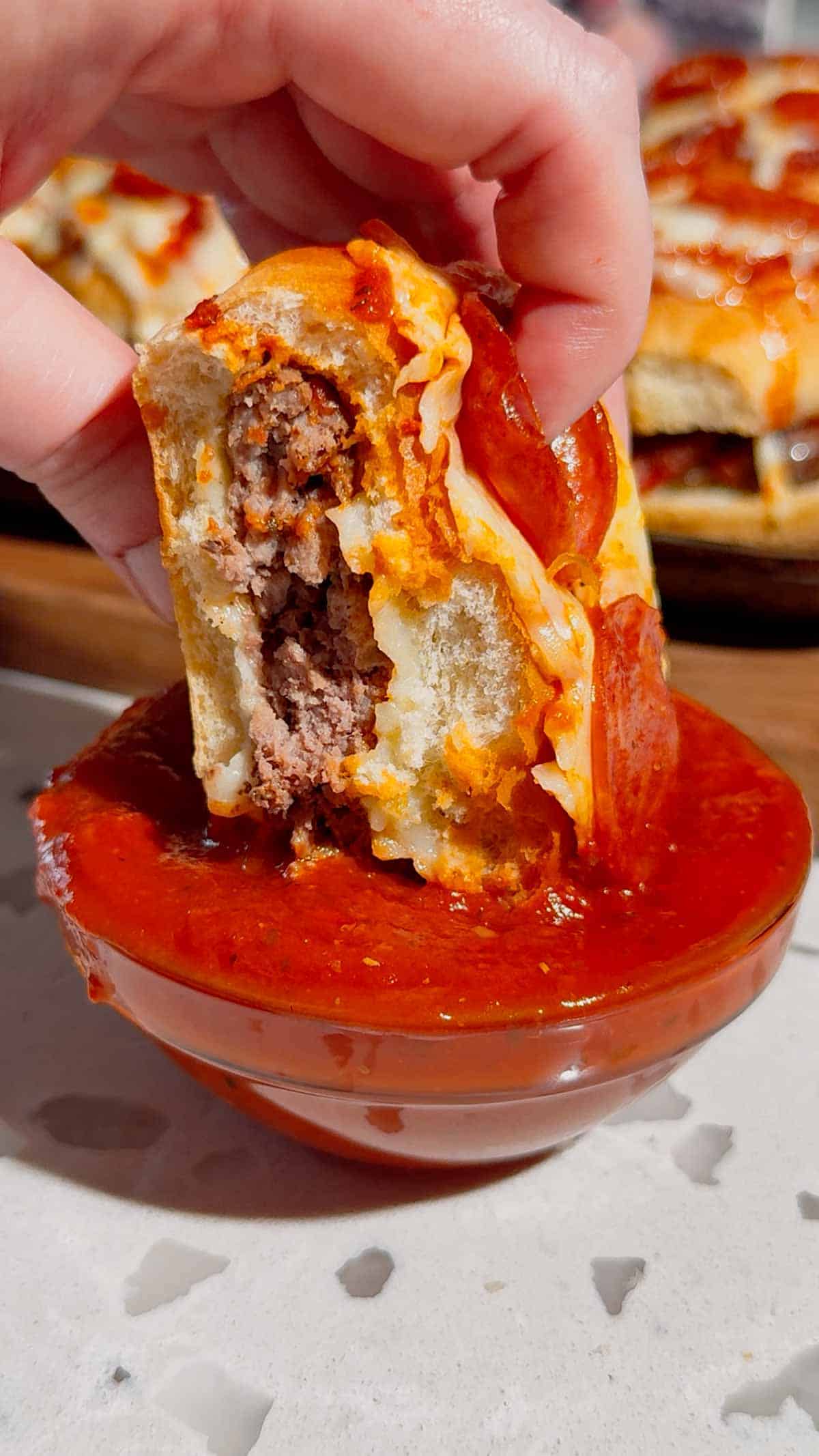 Looking for the ultimate Pizza Burgers recipe? These easy Pizza Burger sandwiches combine juicy seasoned ground beef, gooey mozzarella cheese, pizza sauce, pepperoni, and soft hamburger buns for the perfect family-friendly dinner. If you love Pizza Burger Recipes, Easy Ground Beef Recipes, Weeknight Dinner Ideas, Pizza Sloppy Joes, Cheeseburger Recipes, Pizza Sandwiches, Easy Dinner Recipes For Family, Quick Dinner Ideas, Ground Beef Dinner Recipes, Comfort Food Recipes, Baked Burgers, and fun Pizza Night Ideas, this recipe belongs on your menu. Ready in just 35 minutes with simple ingredients, these cheesy oven-baked burgers are perfect for busy weeknights, game day, parties, or whenever you're craving the flavors of pizza and burgers in one irresistible meal.