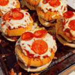 Looking for the ultimate Pizza Burgers recipe? These easy Pizza Burger sandwiches combine juicy seasoned ground beef, gooey mozzarella cheese, pizza sauce, pepperoni, and soft hamburger buns for the perfect family-friendly dinner. If you love Pizza Burger Recipes, Easy Ground Beef Recipes, Weeknight Dinner Ideas, Pizza Sloppy Joes, Cheeseburger Recipes, Pizza Sandwiches, Easy Dinner Recipes For Family, Quick Dinner Ideas, Ground Beef Dinner Recipes, Comfort Food Recipes, Baked Burgers, and fun Pizza Night Ideas, this recipe belongs on your menu. Ready in just 35 minutes with simple ingredients, these cheesy oven-baked burgers are perfect for busy weeknights, game day, parties, or whenever you're craving the flavors of pizza and burgers in one irresistible meal.