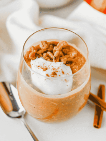 Looking for an easy, healthy breakfast that tastes like fall? These Pumpkin Overnight Oats are creamy, satisfying, and packed with cozy pumpkin pie spice, real pumpkin puree, protein powder, and hearty old fashioned oats for the perfect make-ahead meal. This Pumpkin Overnight Oats Recipe is ideal for meal prep, busy mornings, and anyone searching for high protein overnight oats, healthy pumpkin breakfast ideas, fall breakfast recipes, pumpkin oatmeal, or easy overnight oats with pumpkin puree. Top with vanilla Greek yogurt, nuts, chocolate chips, or maple syrup for a customizable breakfast that's filling, delicious, and ready to grab straight from the fridge all week long.