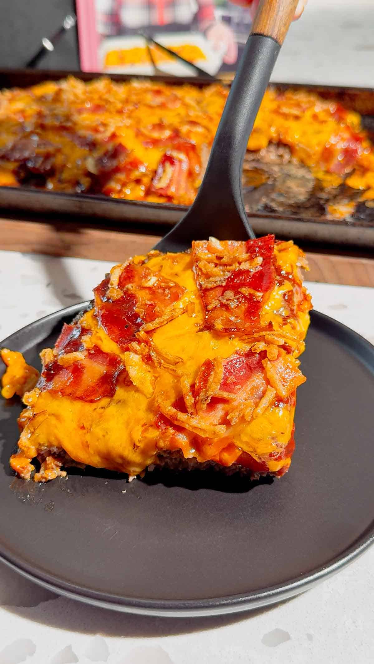 Looking for the ultimate Sheet Pan BBQ Bacon Cheeseburger Meatloaf recipe? This easy family dinner combines juicy ground beef, smoky BBQ sauce, crispy bacon, melty cheddar cheese, and crunchy fried onions for a comfort food meal everyone will love. If you're searching for Sheet Pan Dinners, Easy Meatloaf Recipes, Ground Beef Dinner Ideas, Weeknight Dinner Ideas, Family Dinner Recipes, Cheeseburger Meatloaf, BBQ Meatloaf Recipe, Easy Ground Beef Recipes, Comfort Food Dinners, Sheet Pan Meals, or Quick Dinner Recipes, this crowd-pleasing recipe belongs on your menu. Ready in just 45 minutes with simple ingredients, it's perfect for busy nights, meal planning, potlucks, or whenever you're craving a cheesy, bacon-loaded dinner the whole family will request again and again.