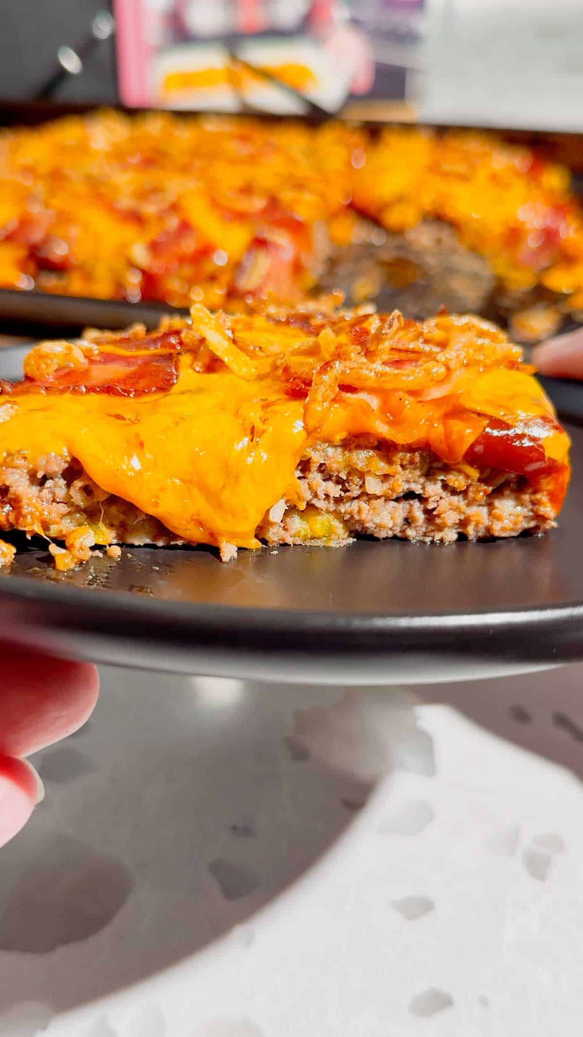 Looking for the ultimate Sheet Pan BBQ Bacon Cheeseburger Meatloaf recipe? This easy family dinner combines juicy ground beef, smoky BBQ sauce, crispy bacon, melty cheddar cheese, and crunchy fried onions for a comfort food meal everyone will love. If you're searching for Sheet Pan Dinners, Easy Meatloaf Recipes, Ground Beef Dinner Ideas, Weeknight Dinner Ideas, Family Dinner Recipes, Cheeseburger Meatloaf, BBQ Meatloaf Recipe, Easy Ground Beef Recipes, Comfort Food Dinners, Sheet Pan Meals, or Quick Dinner Recipes, this crowd-pleasing recipe belongs on your menu. Ready in just 45 minutes with simple ingredients, it's perfect for busy nights, meal planning, potlucks, or whenever you're craving a cheesy, bacon-loaded dinner the whole family will request again and again.
