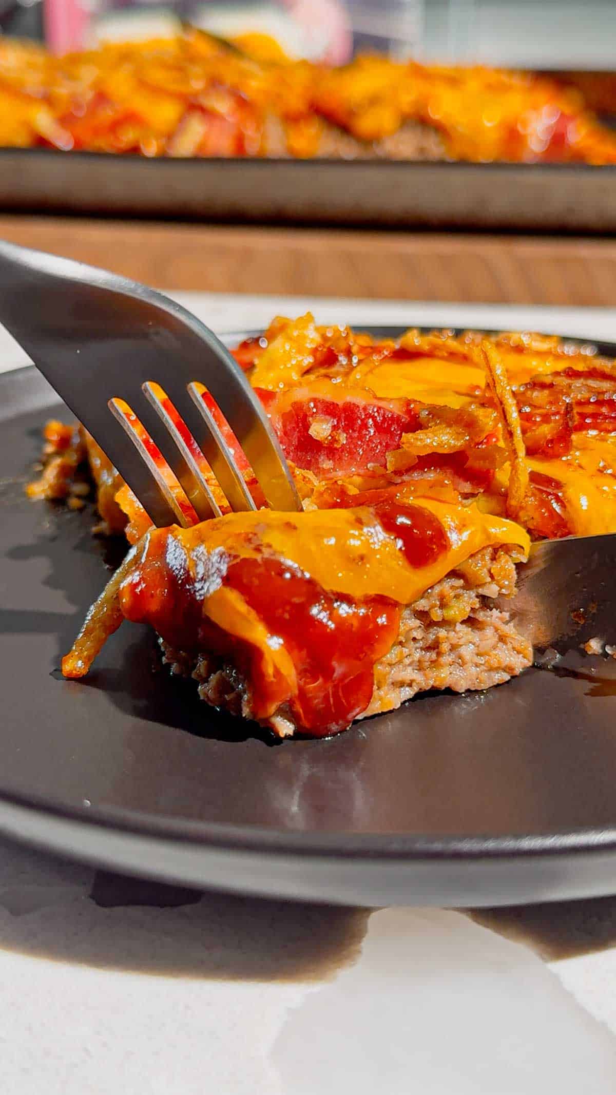 Looking for the ultimate Sheet Pan BBQ Bacon Cheeseburger Meatloaf recipe? This easy family dinner combines juicy ground beef, smoky BBQ sauce, crispy bacon, melty cheddar cheese, and crunchy fried onions for a comfort food meal everyone will love. If you're searching for Sheet Pan Dinners, Easy Meatloaf Recipes, Ground Beef Dinner Ideas, Weeknight Dinner Ideas, Family Dinner Recipes, Cheeseburger Meatloaf, BBQ Meatloaf Recipe, Easy Ground Beef Recipes, Comfort Food Dinners, Sheet Pan Meals, or Quick Dinner Recipes, this crowd-pleasing recipe belongs on your menu. Ready in just 45 minutes with simple ingredients, it's perfect for busy nights, meal planning, potlucks, or whenever you're craving a cheesy, bacon-loaded dinner the whole family will request again and again.