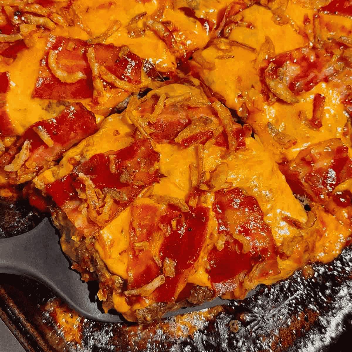 Looking for the ultimate Sheet Pan BBQ Bacon Cheeseburger Meatloaf recipe? This easy family dinner combines juicy ground beef, smoky BBQ sauce, crispy bacon, melty cheddar cheese, and crunchy fried onions for a comfort food meal everyone will love. If you're searching for Sheet Pan Dinners, Easy Meatloaf Recipes, Ground Beef Dinner Ideas, Weeknight Dinner Ideas, Family Dinner Recipes, Cheeseburger Meatloaf, BBQ Meatloaf Recipe, Easy Ground Beef Recipes, Comfort Food Dinners, Sheet Pan Meals, or Quick Dinner Recipes, this crowd-pleasing recipe belongs on your menu. Ready in just 45 minutes with simple ingredients, it's perfect for busy nights, meal planning, potlucks, or whenever you're craving a cheesy, bacon-loaded dinner the whole family will request again and again.