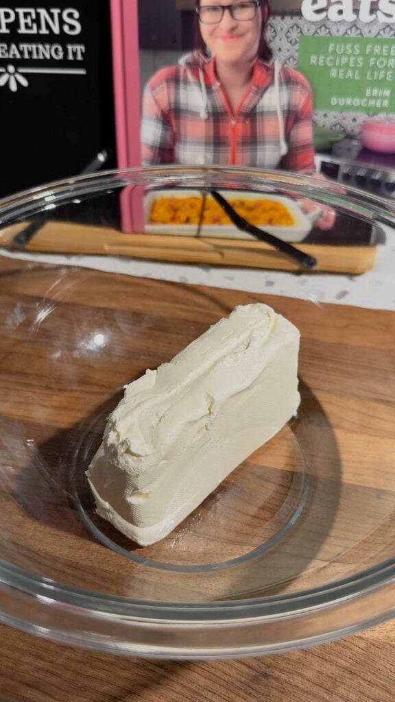 cream cheese in a glass mixing bowl
