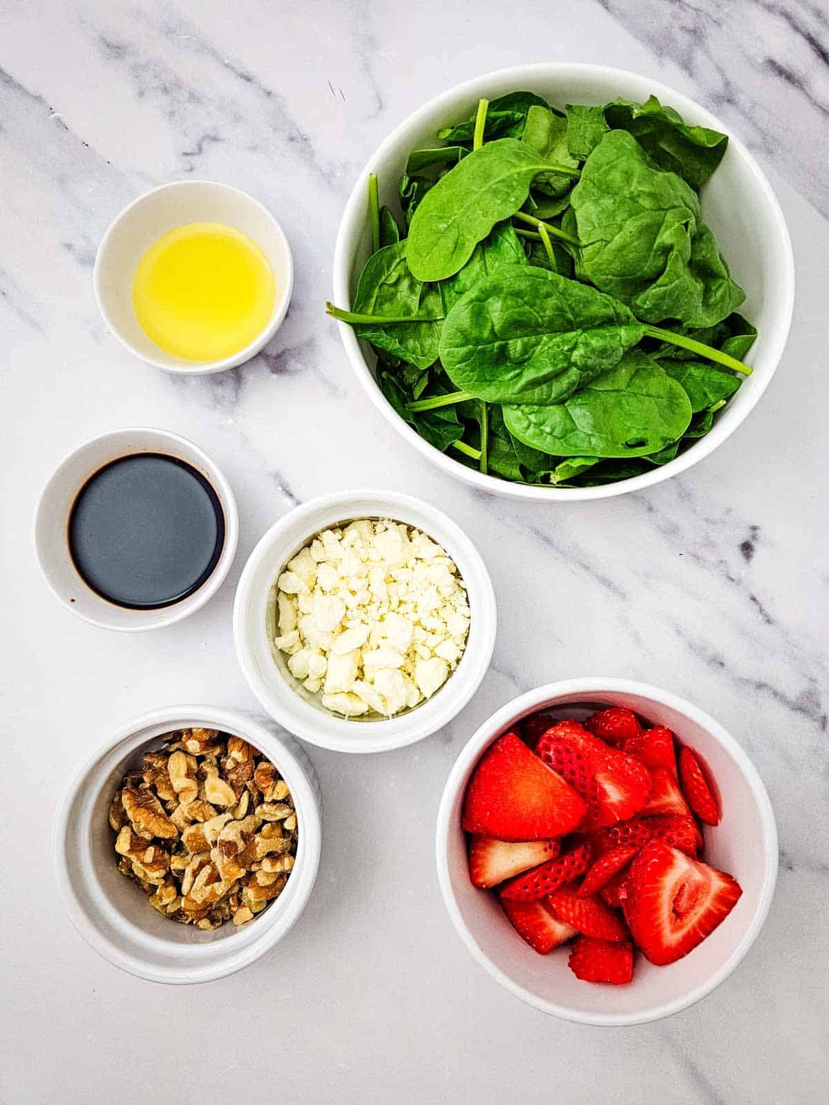 strawberry spinach salad ingredients on the kitchen counter