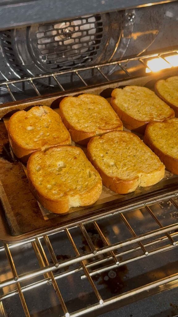 texas toast garlic bread baking until golden in the oven