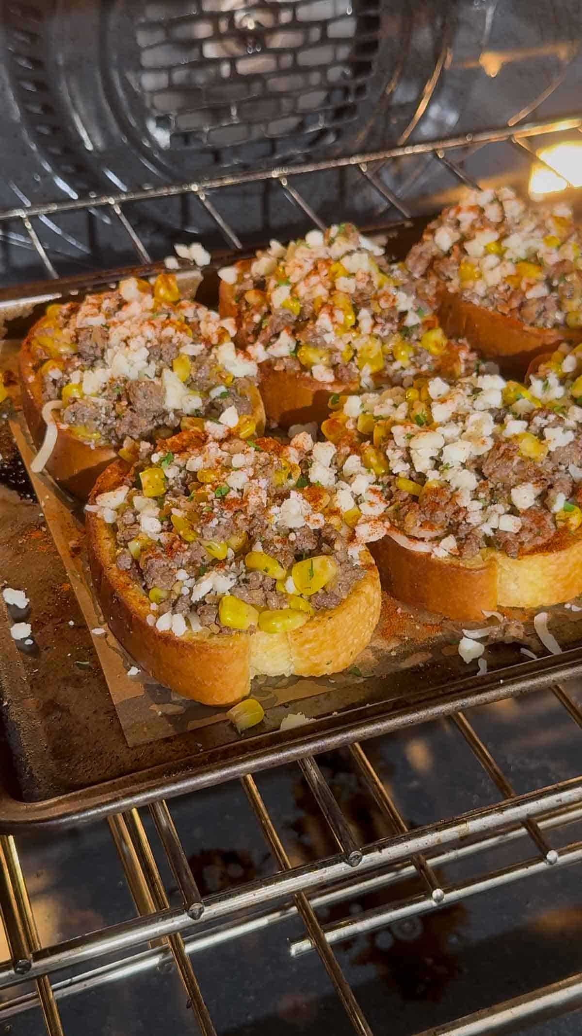 street corn garlic toasts placed in the oven to bake