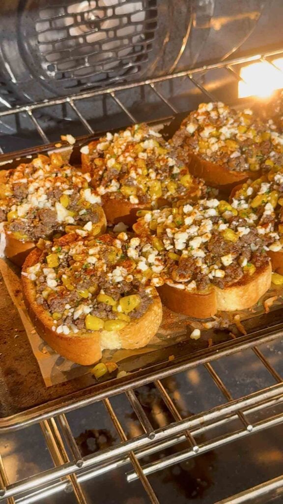 street corn beef garlic toasts baking in the oven