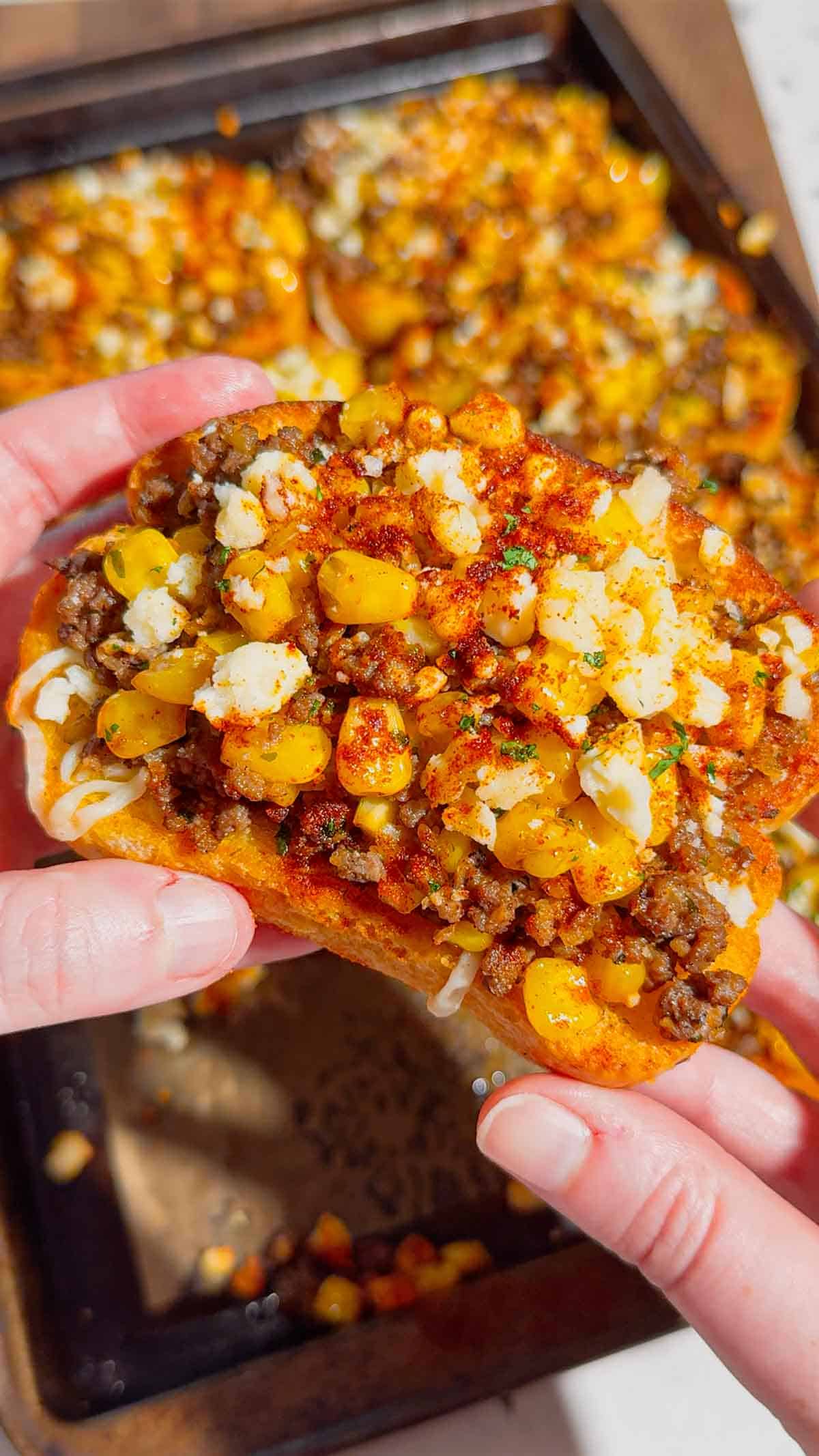 Need an easy dinner that's guaranteed to disappear fast? These Street Corn Beef Garlic Toasts combine crispy Texas garlic toast with seasoned ground beef, smoky street corn, melty mozzarella, tangy Cotija cheese, and a creamy lime sauce for the ultimate family meal. This easy ground beef recipe is perfect for busy weeknights, game day appetizers, party snacks, or quick comfort food dinners. If you're searching for easy dinner recipes, garlic bread recipes, ground beef dinner ideas, Texas toast recipes, Mexican-inspired recipes, street corn recipes, cheesy beef recipes, easy appetizer ideas, or family-friendly meals, this delicious recipe is packed with bold flavor, simple ingredients, and is ready in just 35 minutes. Save this recipe for your next easy weeknight dinner!