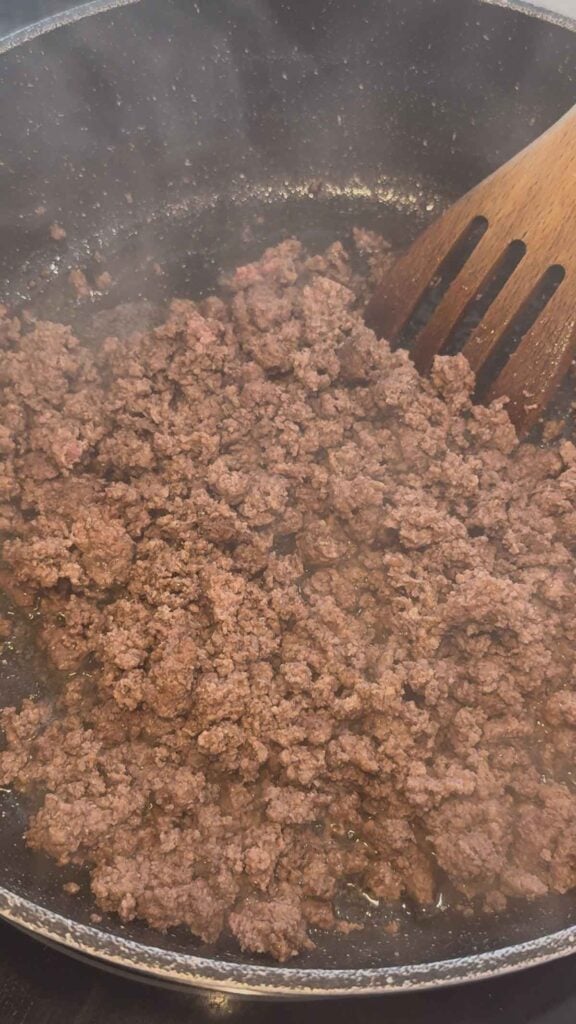 cooked ground beef in a skillet