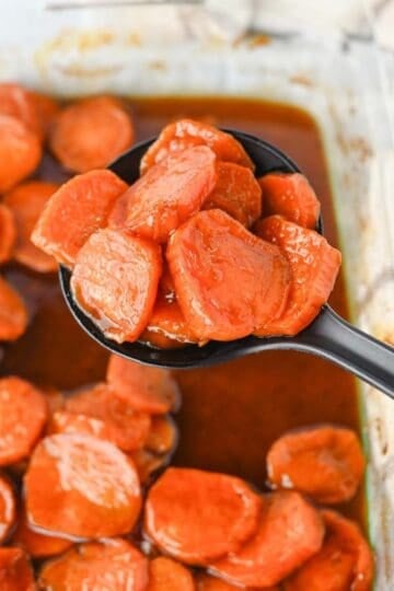These Candied Sweet Potatoes are the ultimate sweet and buttery side dish for Thanksgiving, Christmas, Sunday dinner, and cozy fall meals! Tender sliced sweet potatoes are baked in a rich brown sugar and maple syrup glaze with butter, cinnamon, nutmeg, ginger, and vanilla for incredible caramelized flavor in every bite. If you’re searching for an Easy Candied Sweet Potatoes Recipe, Southern Candied Sweet Potatoes, Baked Sweet Potato Recipes, Thanksgiving Sweet Potato Recipes, Holiday Side Dishes, or Easy Thanksgiving Sides, save this one! These Maple Candied Sweet Potatoes require simple ingredients and just 20 minutes of prep. Serve these glazed sweet potatoes alongside turkey, ham, chicken, or roast beef for a comforting side dish everyone will be excited to see on the dinner table.