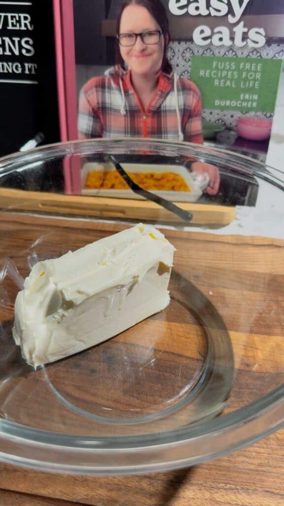 cream cheese in a glass mixing bowl