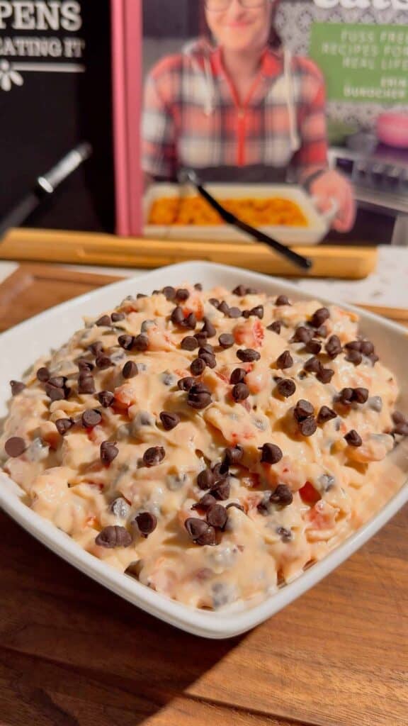 Cherry Chocolate Chip Dip is an easy no bake dessert dip loaded with creamy cream cheese, sweet cherries and mini chocolate chips. This quick dessert dip takes just 15 minutes to make and is perfect for parties, holidays, potlucks, Valentine's Day treats and easy entertaining. If you love chocolate chip dip, cherry desserts, cheesecake dip and sweet cream cheese dip recipes, this simple party dessert is a must-try. Serve this cherry chocolate chip cheesecake dip with graham crackers, vanilla wafers, pretzels, cookies or fresh fruit for dipping. Made with cream cheese, butter, brown sugar, vanilla, candied cherries and chocolate chips, it's a rich and creamy no bake treat. Save this easy dessert dip recipe for your next party, holiday dessert table, girls' night or last-minute sweet treat!