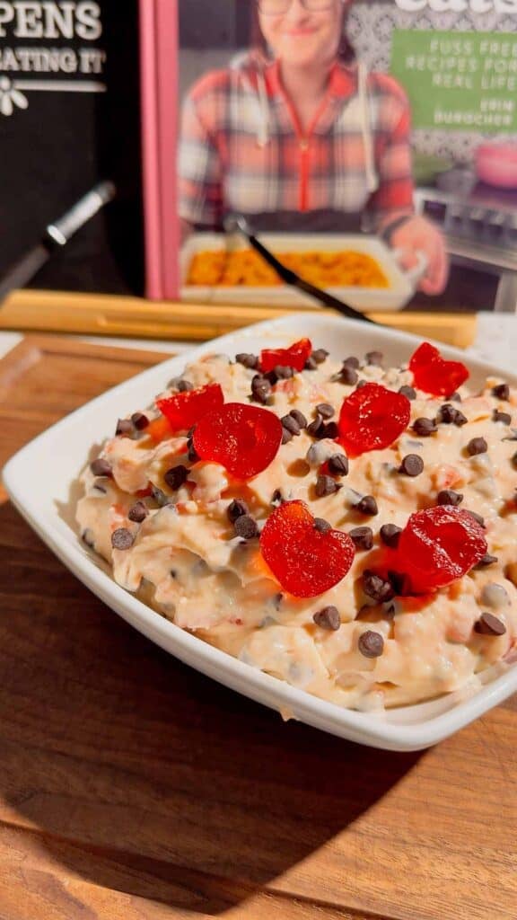 Cherry Chocolate Chip Dip is an easy no bake dessert dip loaded with creamy cream cheese, sweet cherries and mini chocolate chips. This quick dessert dip takes just 15 minutes to make and is perfect for parties, holidays, potlucks, Valentine's Day treats and easy entertaining. If you love chocolate chip dip, cherry desserts, cheesecake dip and sweet cream cheese dip recipes, this simple party dessert is a must-try. Serve this cherry chocolate chip cheesecake dip with graham crackers, vanilla wafers, pretzels, cookies or fresh fruit for dipping. Made with cream cheese, butter, brown sugar, vanilla, candied cherries and chocolate chips, it's a rich and creamy no bake treat. Save this easy dessert dip recipe for your next party, holiday dessert table, girls' night or last-minute sweet treat!